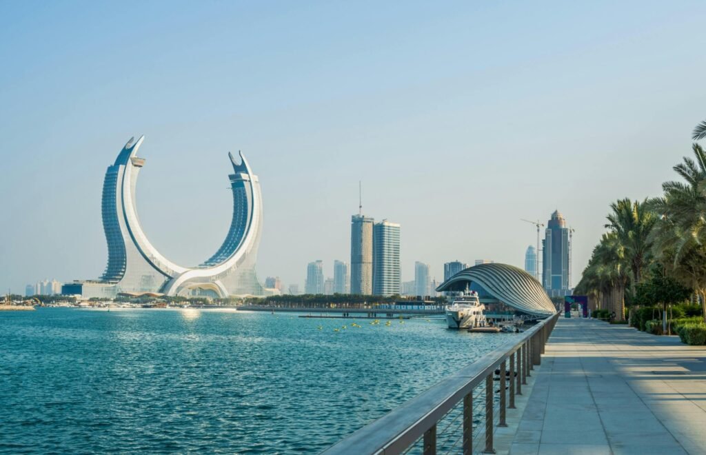 Modern skyline of Dubai featuring the iconic Dubai Frame, with waterfront views and contemporary architecture in the background.