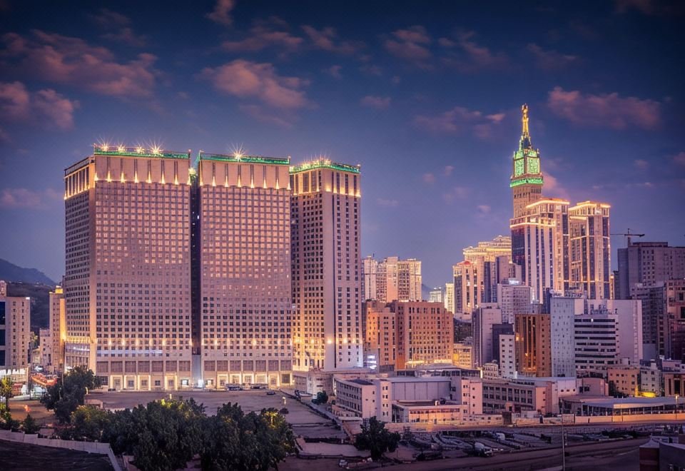 Al Kiswah Towers Hotel Makkah twin towers at dusk with the Clock Tower in the background