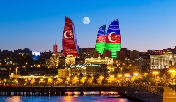 Baku, Azerbaijan - September 22, 2020: Flame Towers in the colors of the flag of Turkey and Azerbaijan - original neon lighting. State symbols of the Turkish and Azerbaijan Republics